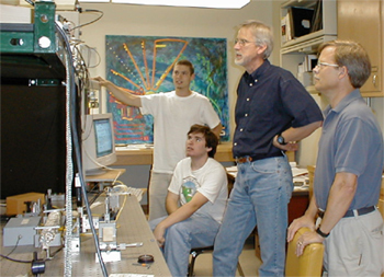 Dr Haskell, Dr. Petersen, Pasqual Rivera, and Kit Rodolfa alongside the OCM instrument.